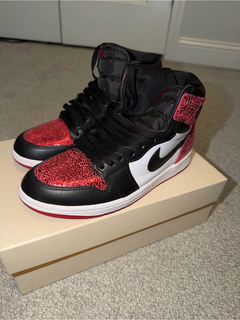 Jordan High-Top Sneakers in Black, White & Red Crackle